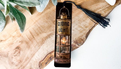 a candle that is sitting on a piece of wood