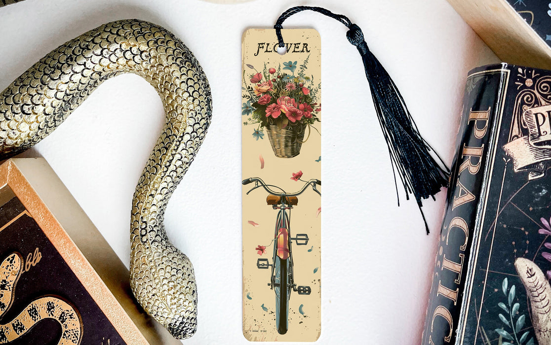 a bookmark with a flower in a basket and a snake