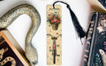 a bookmark with a flower in a basket and a snake