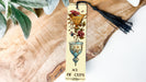 a bookmark with a tassel hanging from it