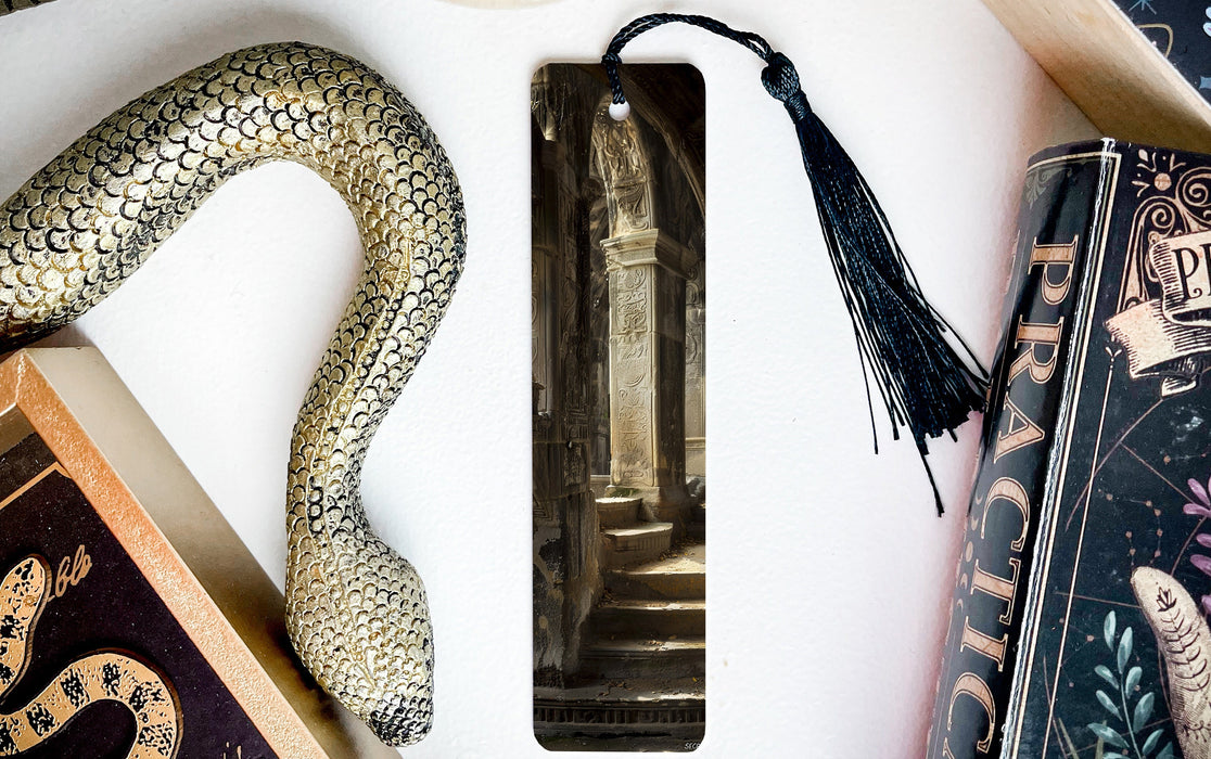 a snake, books, and a bookmark on a table