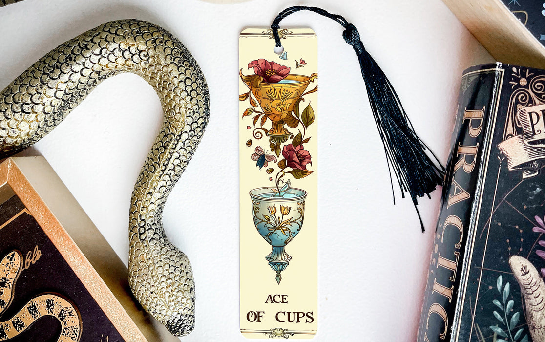 a bookmark with a picture of a vase and a snake