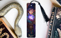 a bookmark with a picture of a woman holding a crystal ball