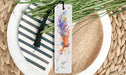 a close up of a plate with a bookmark