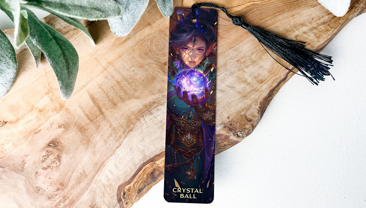 a bookmark with a picture of a woman holding a crystal ball