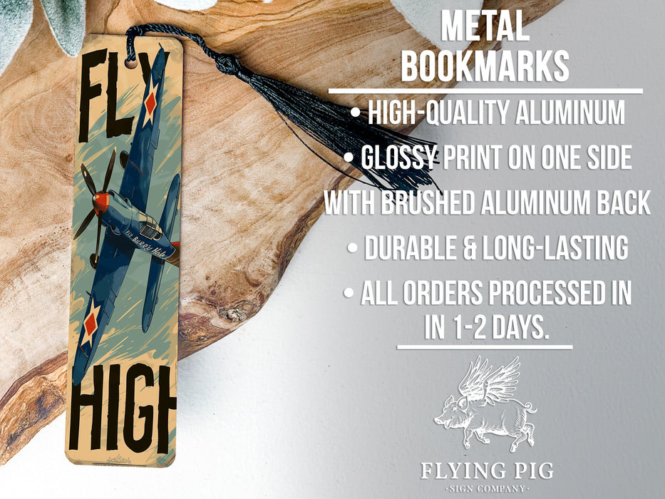 a metal bookmark with a picture of a plane on it