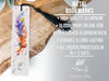 a metal bookmark with a feather on it