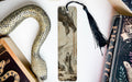 a bookmark with a snake and a book on it