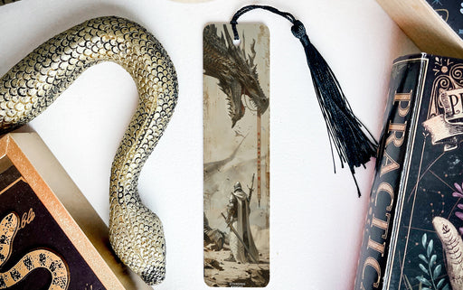 a bookmark with a snake and a book on it