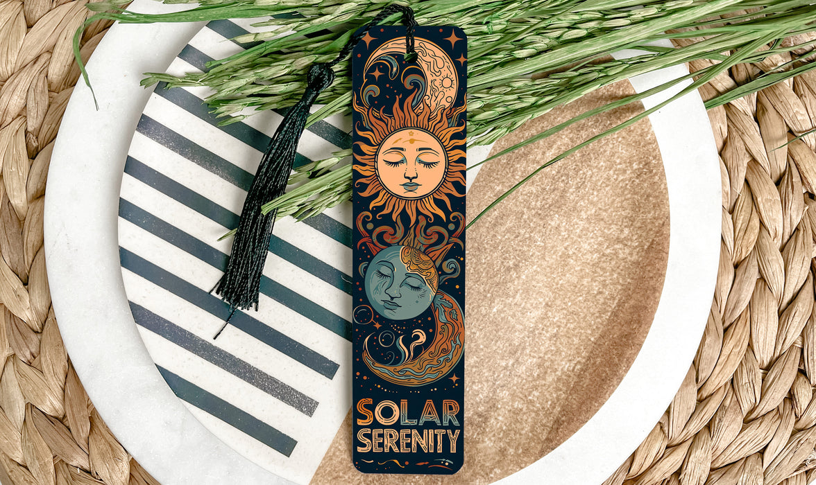 a bookmark with a sun and a moon on it