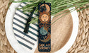 a bookmark with a sun and a moon on it