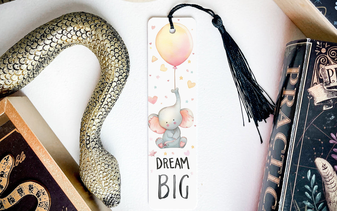 a bookmark with an elephant and a balloon on it