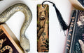 a bookmark with a bear and a snake on it