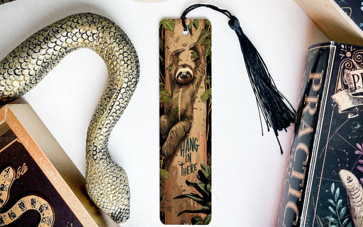 a bookmark with a bear and a snake on it