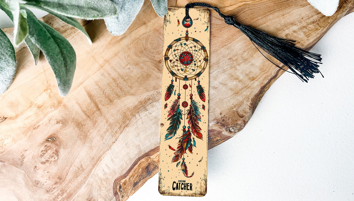 a wooden bookmark with a tassel hanging from it