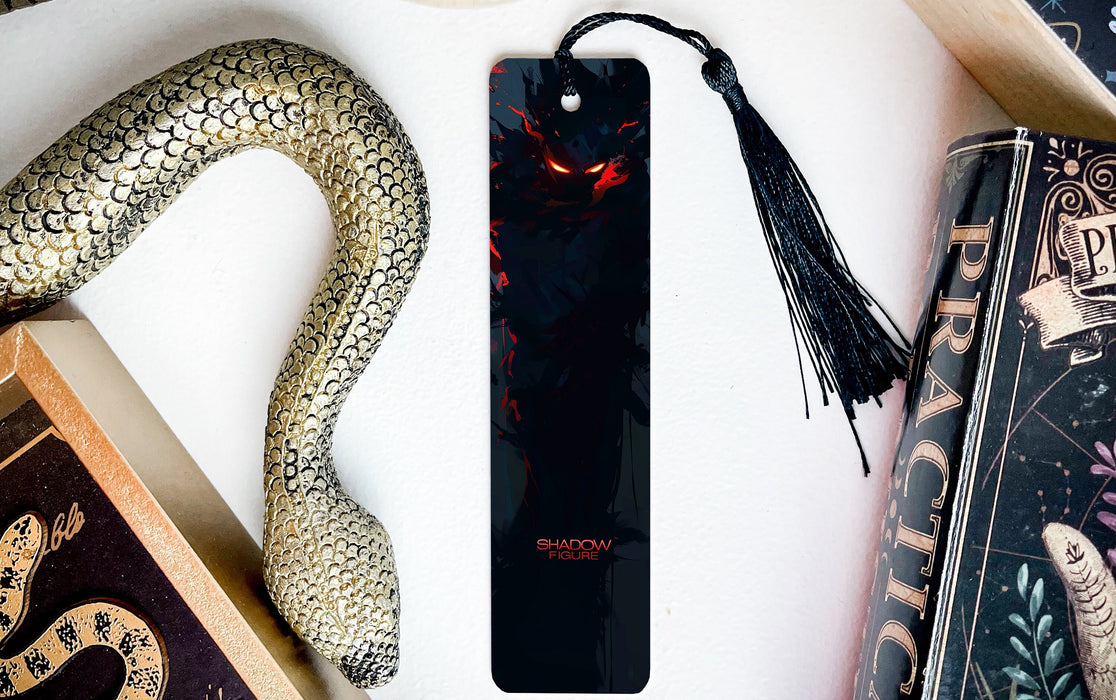 a bookmark with an evil face on it