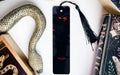a bookmark with an evil face on it