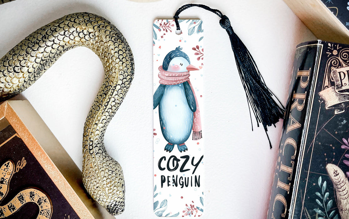 a bookmark with a penguin and a snake on it