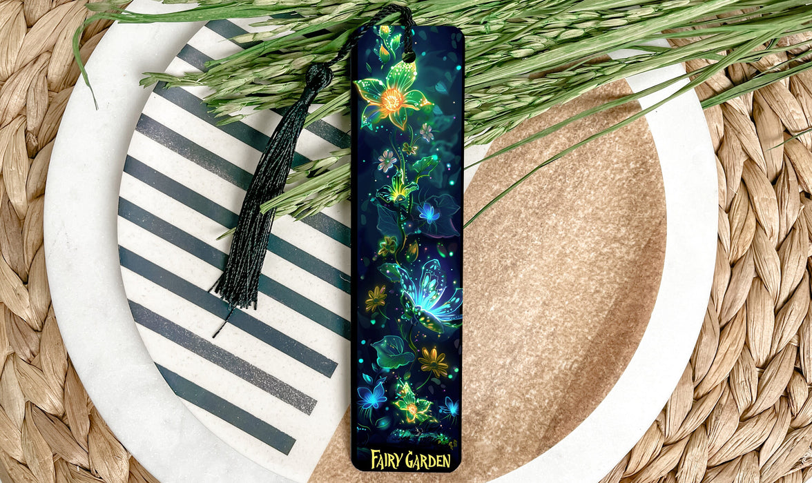 a bookmark on a plate next to a plant