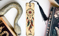 a bookmark, snake, and other items on a table