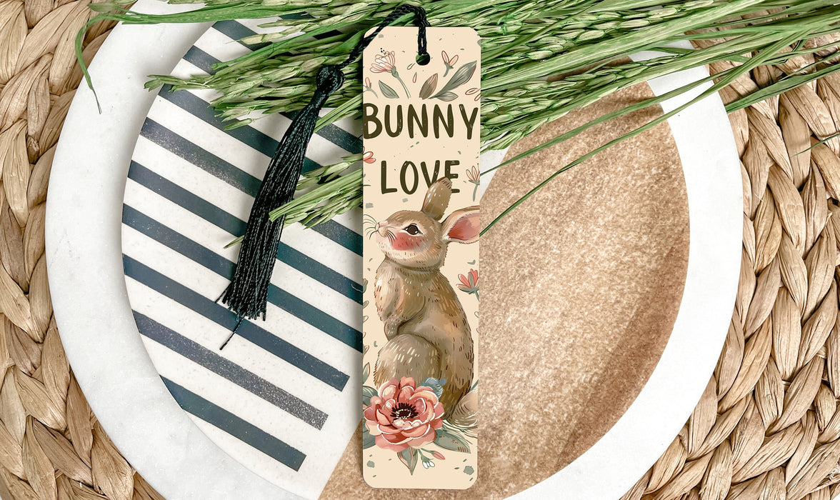 a bookmark with a bunny on it sitting on a plate