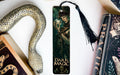 a bookmark with a picture of a woman and a snake on it