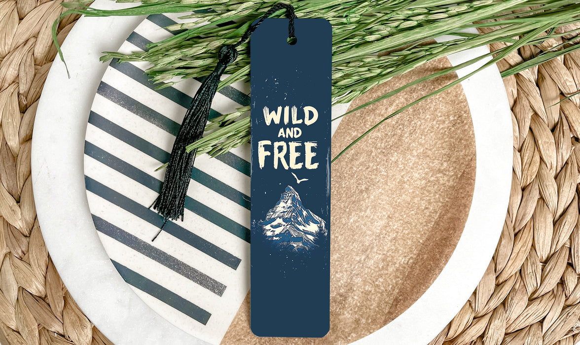 a bookmark that reads wild and free on a plate