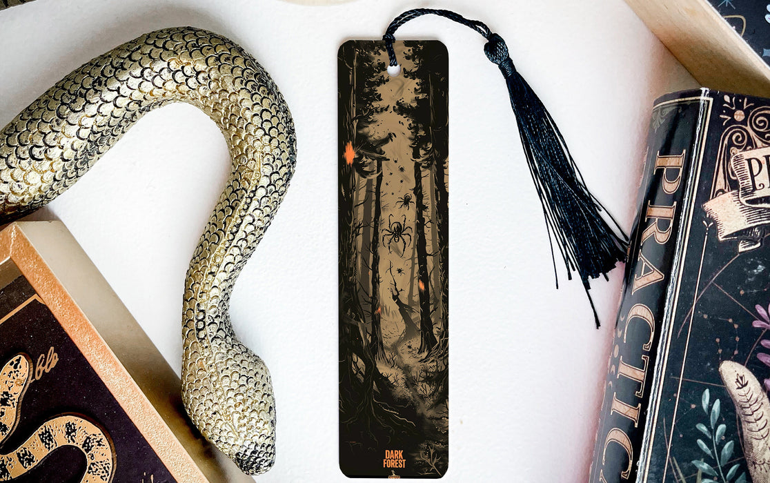 a bookmark, snake, and other items on a table