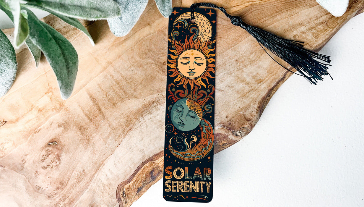 a bookmark with a sun and a moon on it