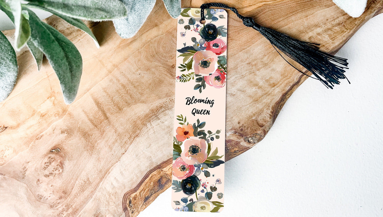 a bookmark with a floral design and a tassel