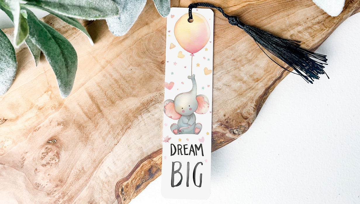 a bookmark with a picture of an elephant holding a balloon