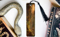 a bookmark with a picture of a woman and a snake on it
