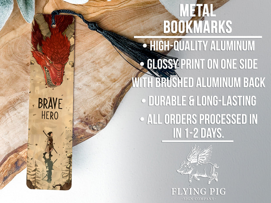 a metal bookmark with a red bird on it