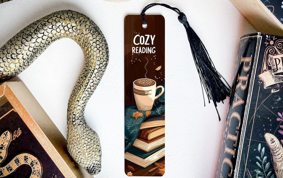 a bookmark with a snake and a cup of coffee