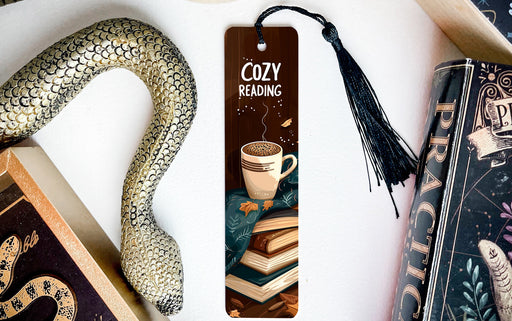 a bookmark with a snake and a cup of coffee