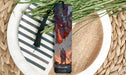 a picture of a dragon bookmark on a plate