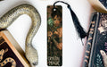 a bookmark with a picture of a woman holding a snake