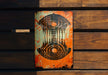 a rusted sign on a wooden wall