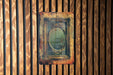 a picture of a mirror on a wooden wall