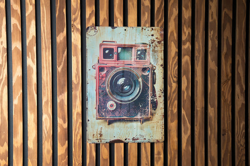 a picture of a camera mounted to a wooden wall