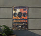 an old, rusty radio on the side of a building