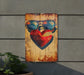 a wooden sign with a heart and sunglasses on it