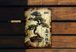 a painting of a bonsai tree on a wooden wall