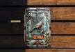 a metal sign with a bird on it