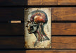 a picture of a human head on a wooden wall