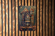 a wooden wall with a picture of a house on it