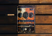 an old radio sitting on top of a wooden bench