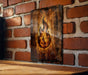 a brick wall with a picture of a fire hydrant on it