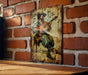 a picture of a man playing a guitar on a brick wall