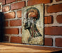 a picture of a human head on a brick wall